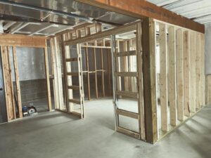 Basement framing in progress, showing new wooden wall studs, a service by Northrup Remodeling in Minneapolis, MN