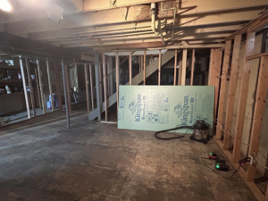 Basement framing and insulation installation during a renovation by Pinnacle Roofing & Construction LLC in Elkhart, IN.