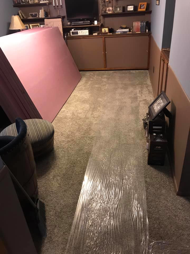 Pink insulation boards and materials for a basement finishing project by Handyman Nextdoor in Omaha, NE