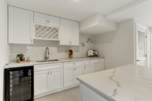 Basement kitchenette with wine rack and cabinets installed by Cabido Design, a handyman in Brentwood, MD.