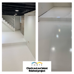 A newly finished basement painting project by Forte Painting Company in Boulder, CO, featuring white walls and floors.