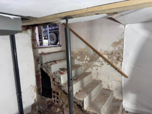 Basement staircase repair and structural support work by Home Pros WV in Charleston, WV.