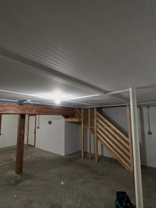 New wooden framing for basement stairs and a freshly installed beadboard ceiling by Kangas Contracting LLC in Chesapeake, VA.