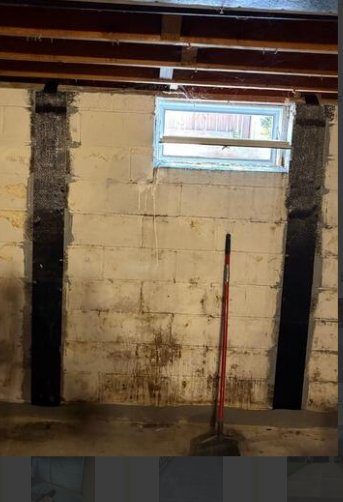 Basement wall with carbon fiber reinforcement straps installed by Woodford Bros., Inc. in Apulia Station, NY