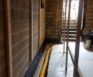 Basement wall framing and drainage system installation by ARK Basement Services - Erie, PA