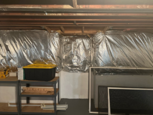 A basement wall with reflective insulation installed by JDS Home Improvement in Gaithersburg, MD.
