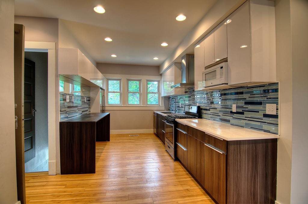Finished basement with a wet bar and built-in bookshelves by S. Brown Construction Co. in Lafayette, IN