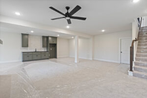 A newly installed basement wet bar with cabinets and sink by Elevate Design + Build in Philomath, OR.
