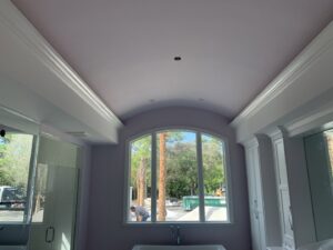 Bathroom ceiling with curved design and crown molding installed by D&G Drywall in Fort Lauderdale, FL