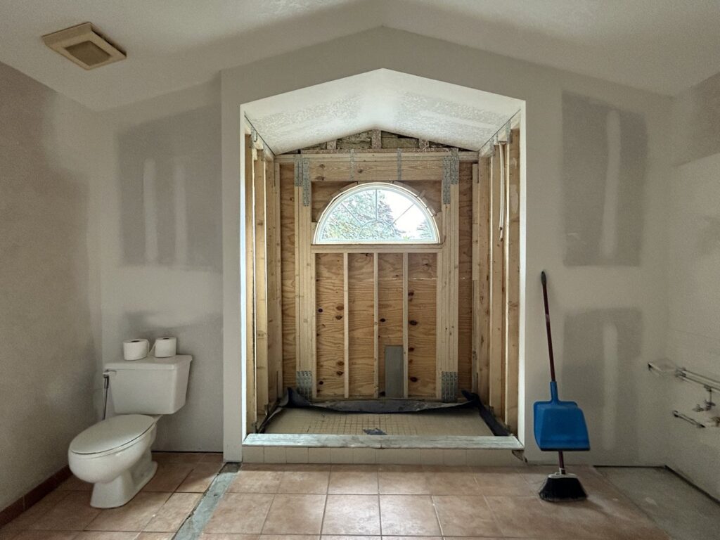 Bathroom demolition and early renovation stages by Modern Construction Group Inc. in Orlando, FL.