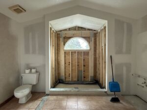 Bathroom demolition and early renovation stages by Modern Construction Group Inc. in Orlando, FL.