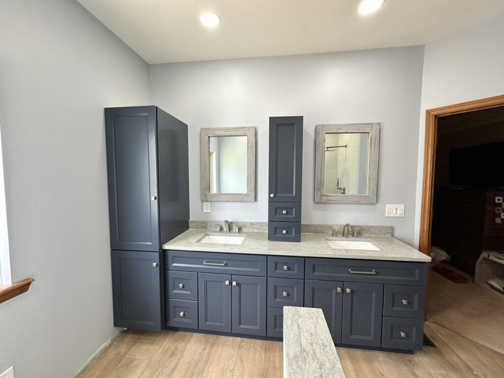 A spacious bathroom with a double vanity and tall storage cabinets, completed by Lynden Remodeling in Cincinnati, OH