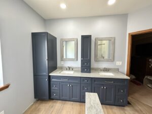 A spacious bathroom with a double vanity and tall storage cabinets, completed by Lynden Remodeling in Cincinnati, OH