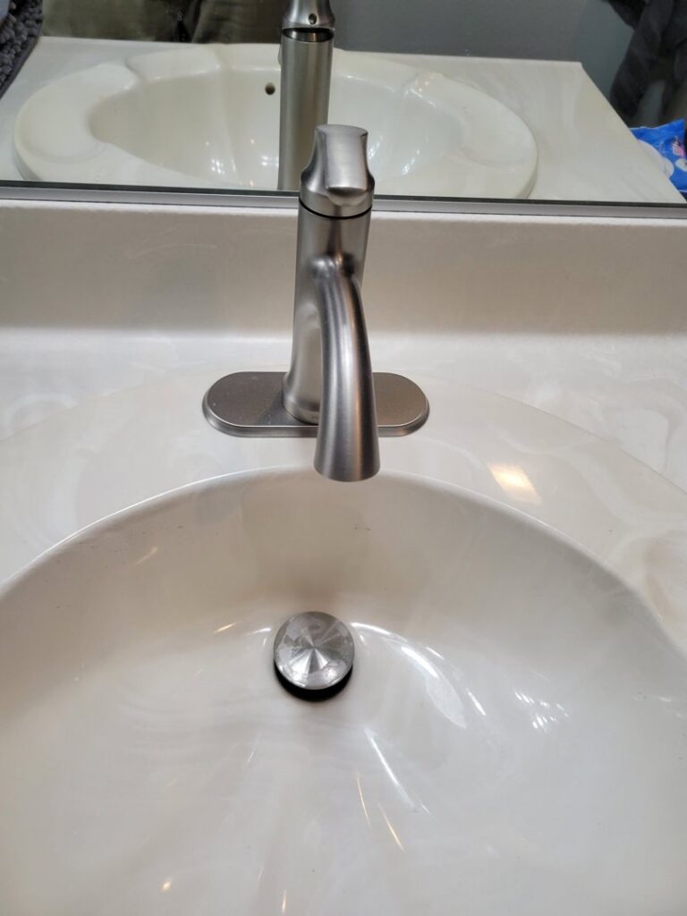 A new bathroom faucet and sink drain stopper installed by McCarran Handyman Services in Boulder City, NV.
