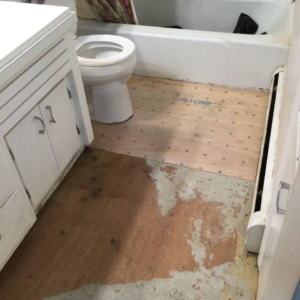 Bathroom floor renovation in progress, showing subfloor and new underlayment by Mr. Handyman of Charleston and Summerville, Summerville, SC.