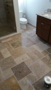Newly installed bathroom floor tile by Priority One Home Repair LLC in Glendale, AZ