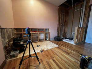 Bathroom framing and plumbing rough-in with a laser level during renovation by Fine Line Painting and Design in Georgetown, KY.