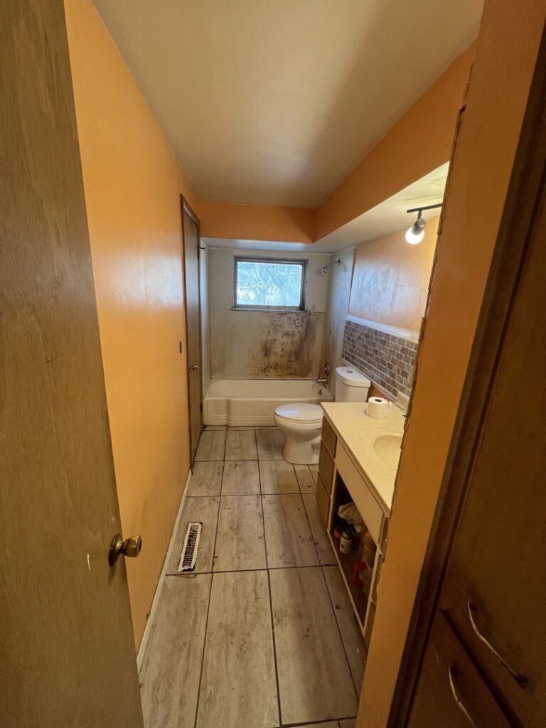 A bathroom showing significant mold and mildew on walls and around the bathtub, indicating a need for remediation by Jarrett's Home Improvements & Maintenance Services in Columbus, OH