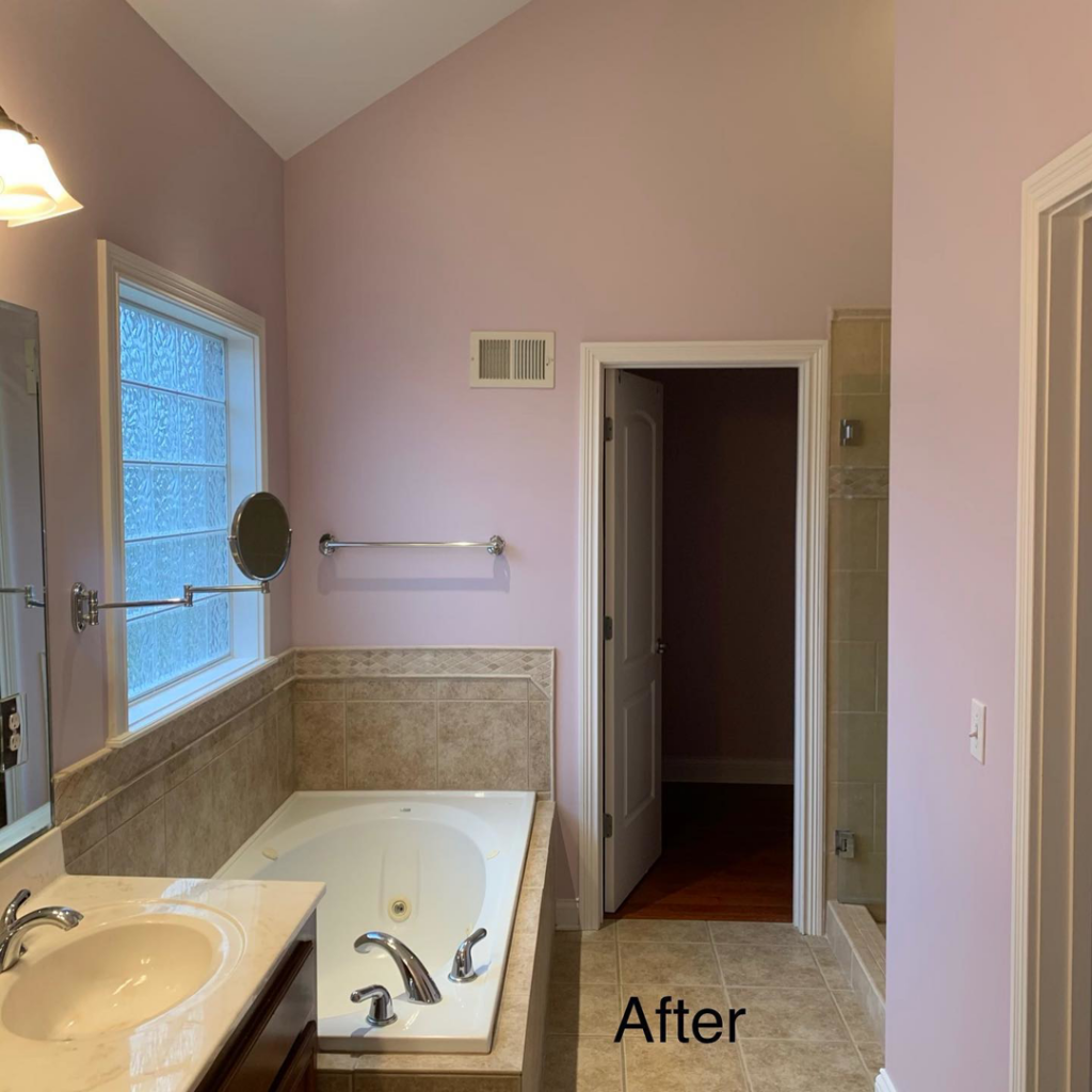 An "After" photo of a bathroom with light purple walls, completed by Wilder Painting, LLC in Quincy, MA