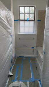 Bathroom fully prepped with plastic sheeting for tub and tile refinishing by Phillys Finest Tub & Tile Refinishing in Philadelphia, PA
