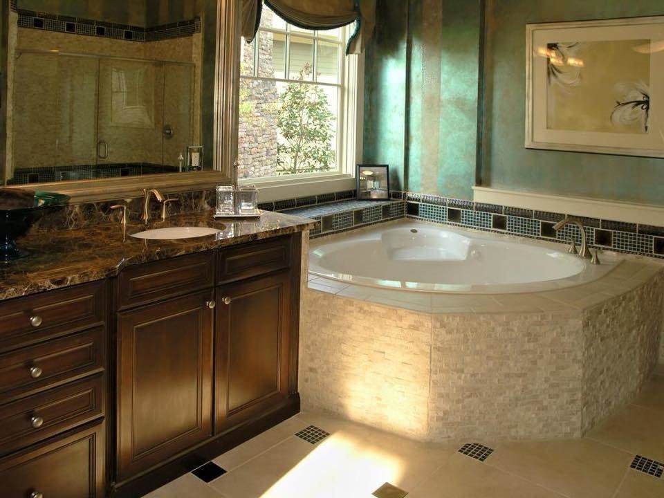 Completed bathroom remodel with a corner tub and stone vanity by Art of Stone Shop in Bridgeport, CT.