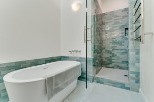 A complete bathroom remodel featuring a freestanding tub and glass shower enclosure by Matt Bennett Construction in Junction City, OR