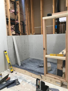 A bathroom remodel in progress with shower framing and cement board installation by DiMaggio Construction Inc. in Columbus, OH