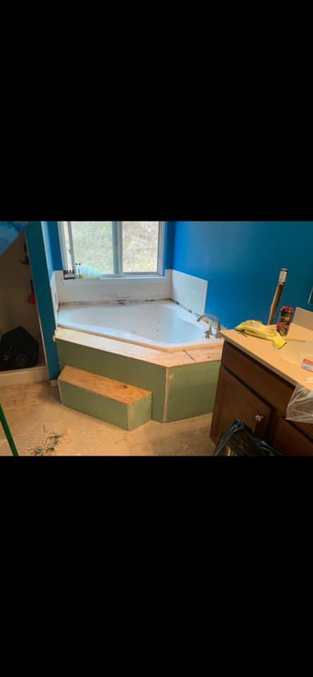 A bathroom remodel in progress, showing the framing around a corner bathtub before finishing, by Berling Remodeling llc in Highland Heights, KY.