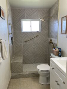 A beautifully remodeled bathroom featuring a tiled walk-in shower by HandyMation in Cheyenne, WY