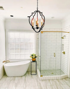 A bathroom remodel featuring a freestanding tub and a walk-in shower with white subway tiles by CMT Construction LLC in Columbia, MO.