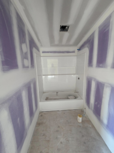 Bathroom remodeling project with new drywall and bathtub installation by J M Construction & Remodeling in Humble, TX.