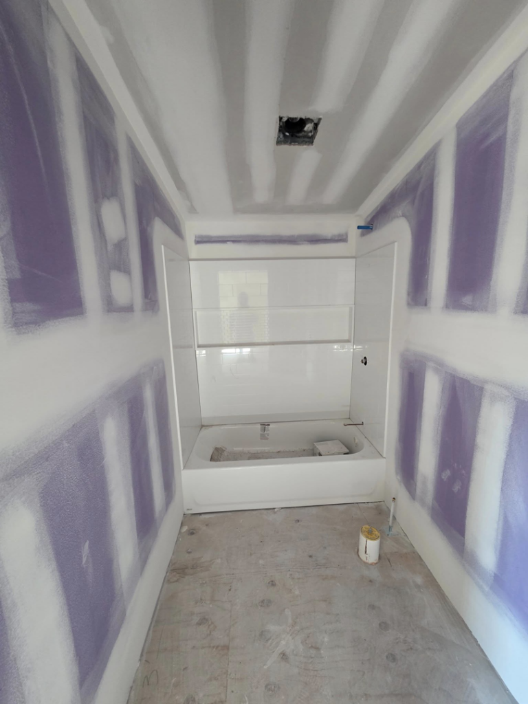 Bathroom remodeling project with new drywall and bathtub installation by J M Construction & Remodeling in Humble, TX.