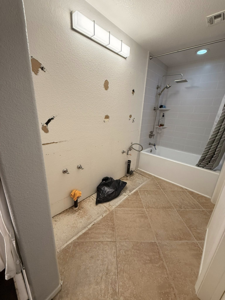 A bathroom during the demolition phase of a renovation project by Pauda Handyman in San Diego, CA.