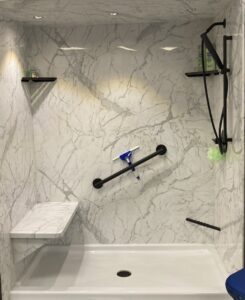 A complete bathroom renovation featuring a double vanity and new bathtub by Bath Planet of STL & More in Saint Charles, MO.