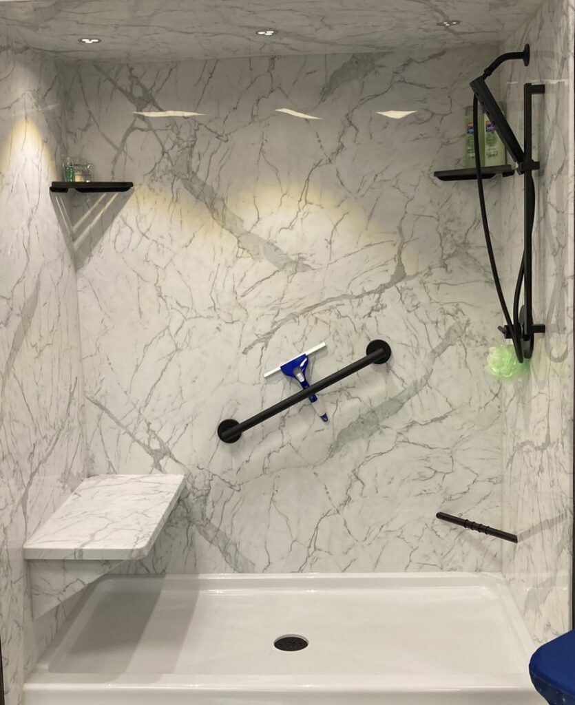 A complete bathroom renovation featuring a double vanity and new bathtub by Bath Planet of STL & More in Saint Charles, MO.