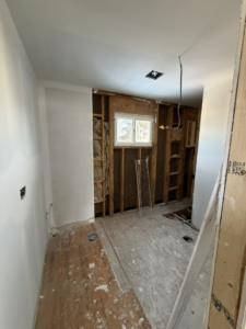 Bathroom renovation in progress with new drywall and plumbing rough-ins by Building Better Homes Management in Cincinnati, OH.