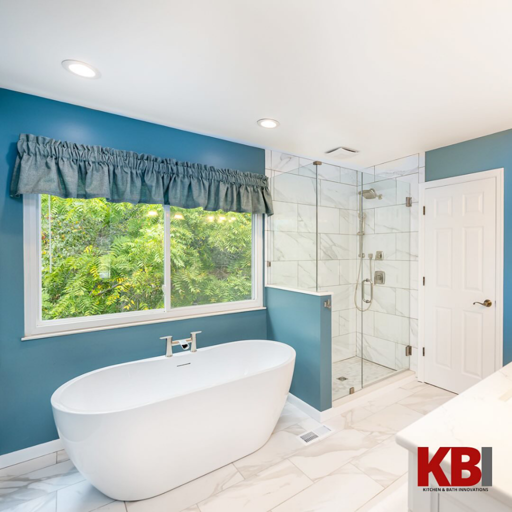 A beautifully renovated bathroom featuring a freestanding tub and walk-in shower by Kitchen and Bath Innovations in Cincinnati, OH