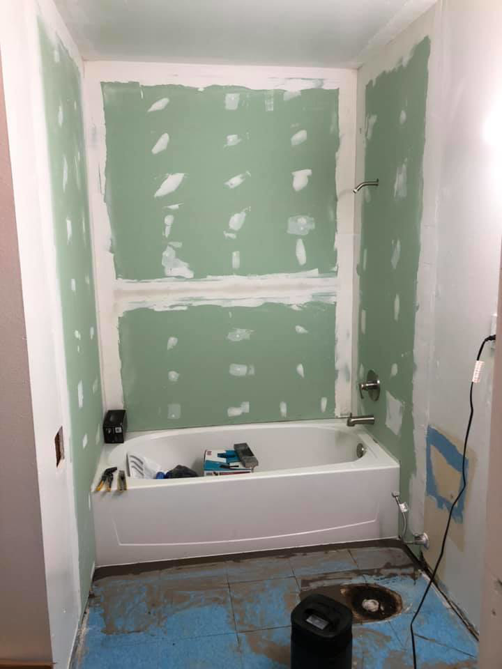 Bathroom renovation in progress with new drywall and tub installation by J & J Cavallo Custom, LLLP in Yakima, WA