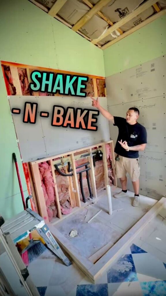 A general contractor inspecting a bathroom renovation in progress, showing framing and drywall by TEXAN Home Improvements LLC in San Antonio, TX.