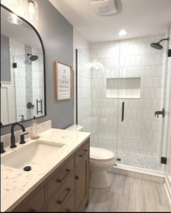 A complete bathroom renovation featuring a new vanity, toilet, and walk-in tiled shower by Valley Wide Design & Build in San Tan Valley, AZ.