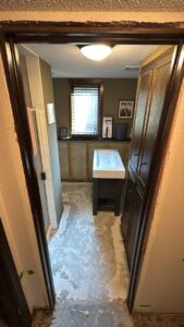 A bathroom renovation in progress with a new vanity and sink installed by Hawk Handyman Services in West Fargo, ND
