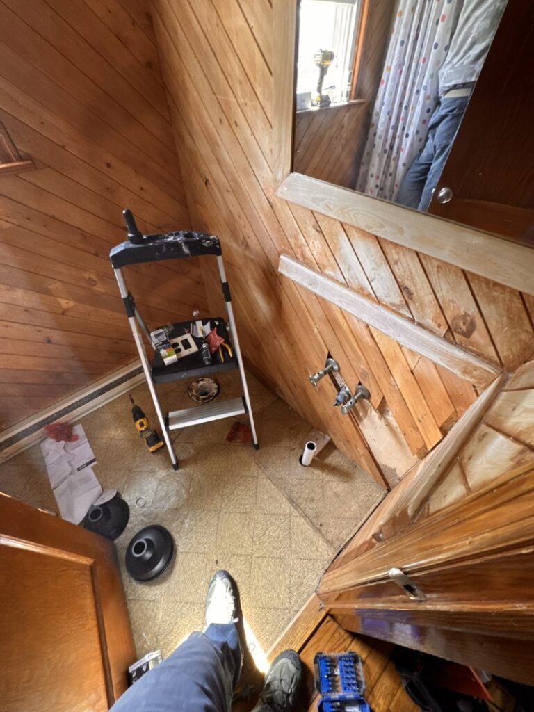 A bathroom renovation in progress with tools and exposed plumbing by Premier Handyman Services in Lexington, KY.