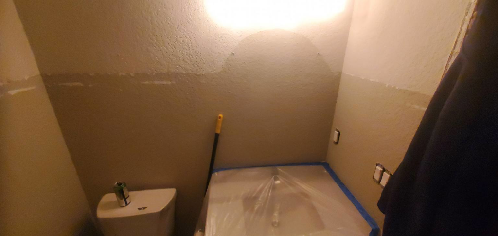 Bathroom walls prepped for painting and renovation by Justin-case Repairs in Ankeny, IA.