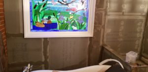 An ongoing bathroom renovation showing cement board installation and tub placement by Raleigh Renovations & Flooring in Cary, NC.