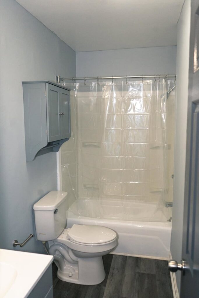 Bathroom renovation featuring new toilet, shower, and wall cabinet by Vermont Professional Solutions LLC in South Burlington, VT.