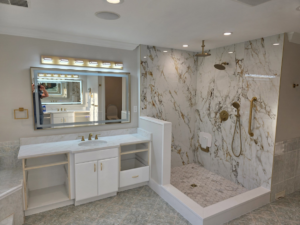 A bathroom renovation project showing a new shower and vanity installation in progress by SG Homes LLC in Rockville, MD