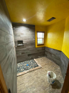 Bathroom shower and floor tile project in progress by Quality Craftsman Construction in Longwood, FL.