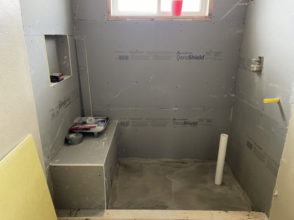 A bathroom shower area under construction with DensShield installed by HandyMation in Cheyenne, WY