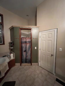 Completed bathroom shower enclosure and door installation by Hewitt&Son in Newport News, VA.