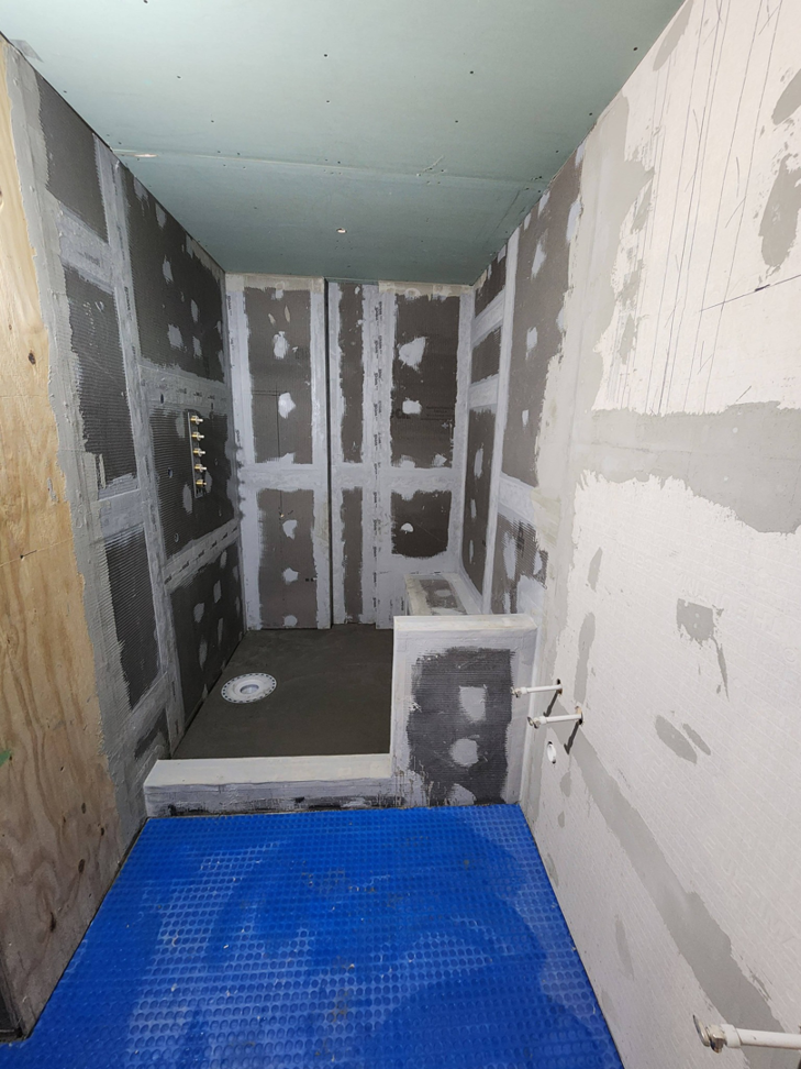 A bathroom shower area under renovation with cement board installation by AJAC Restore&Construct LLC in Houma, LA.